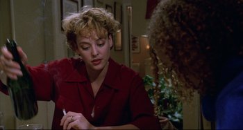 Movie still from “Candyman” (1992), directed by Bernard Rose – A woman sitting at a table writing on a piece of paper; Close Up shot, Over the shoulder angle