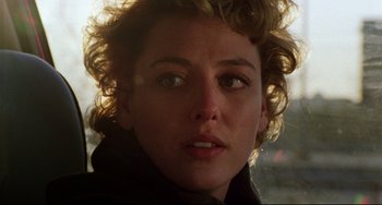 Movie still from “Candyman” (1992), directed by Bernard Rose – A woman's face in the sunlight; Close Up shot, Over the shoulder angle