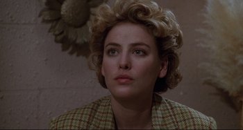 Movie still from “Candyman” (1992), directed by Bernard Rose – A person wearing a jacket; Close Up shot, Over the shoulder angle