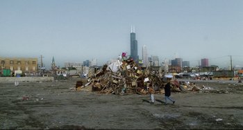 Movie still from “Candyman” (1992), directed by Bernard Rose – A large pile of trash on top of the ground; Extreme Wide shot, High angle