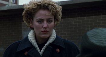 Movie still from “Candyman” (1992), directed by Bernard Rose – A person wearing a jacket; Close Up shot, Over the shoulder angle