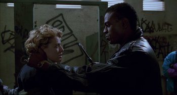 Movie still from “Candyman” (1992), directed by Bernard Rose – A man and a woman are looking at each other; Close Up shot, Low angle