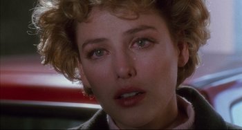 Movie still from “Candyman” (1992), directed by Bernard Rose – A woman's face with tears in her eyes; Close Up shot, Over the shoulder angle