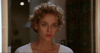 Movie still from “Candyman” (1992), directed by Bernard Rose – A person with short curly hair; Close Up shot, Over the shoulder angle