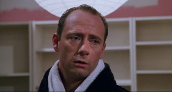 Movie still from “Candyman” (1992), directed by Bernard Rose – A person wearing a robe; Close Up shot, Low angle