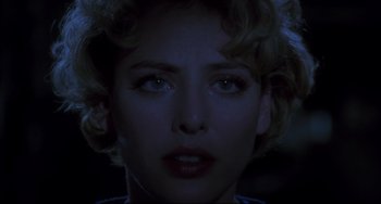 Movie still from “Candyman” (1992), directed by Bernard Rose – A woman's face in the dark; Close Up shot, Over the shoulder angle