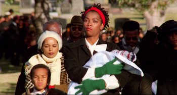 Movie still from “Candyman” (1992), directed by Bernard Rose – A group of people standing in a crowd with green gloves; Close Up shot, Low angle