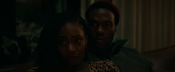 Movie still from “Candyman” (2021), directed by Nia DaCosta – A man and a woman posing for a picture; Close Up shot, Over the shoulder angle