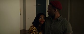 Movie still from “Candyman” (2021), directed by Nia DaCosta – A man and a woman standing next to each other; Close Up shot, Over the shoulder angle