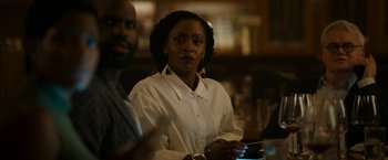 Movie still from “Candyman” (2021), directed by Nia DaCosta – A woman sitting in front of a man at a bar; Close Up shot, Over the shoulder angle