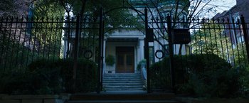 Movie still from “Candyman” (2021), directed by Nia DaCosta – A building that has some steps leading up to it; Extreme Wide shot, Low angle