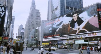Movie still from “Cannibal Holocaust” (1980), directed by Ruggero Deodato – People walking down a street in a large city; Extreme Wide shot, Low angle