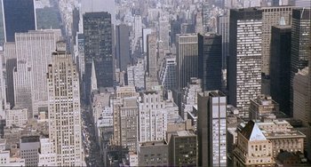 Movie still from “Cannibal Holocaust” (1980), directed by Ruggero Deodato – An aerial view of a city with skyscrapers; Extreme Wide shot, High angle