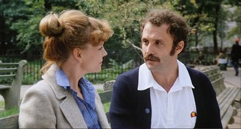 Movie still from “Cannibal Holocaust” (1980), directed by Ruggero Deodato – A man and a woman sitting next to each other on a park bench; Close Up shot, Low angle