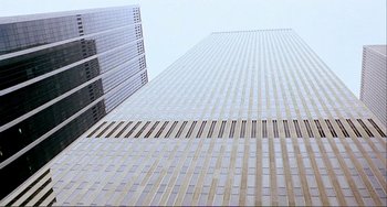 Movie still from “Cannibal Holocaust” (1980), directed by Ruggero Deodato – Looking up at a skyscraper from the ground up; Extreme Wide shot, Low angle