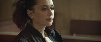 Movie still from “Capernaum” (2018), directed by Nadine Labaki – A person wearing a black jacket; Close Up shot, High angle