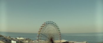 Movie still from “Capernaum” (2018), directed by Nadine Labaki – A ferris wheel that is in the middle of the ocean; Extreme Wide shot, Low angle