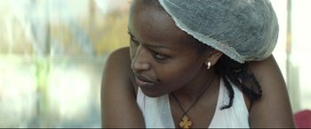 Movie still from “Capernaum” (2018), directed by Nadine Labaki – A person wearing a headscarf; Close Up shot, Over the shoulder angle