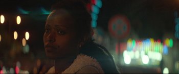Movie still from “Capernaum” (2018), directed by Nadine Labaki – A woman's face in the dark; Close Up shot, Over the shoulder angle