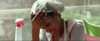 Movie still from “Capernaum” (2018), directed by Nadine Labaki – A woman with her head wrapped in a plastic bag; Close Up shot, Low angle