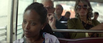 Movie still from “Capernaum” (2018), directed by Nadine Labaki – A woman sitting on a bus next to a man; Close Up shot, Over the shoulder angle