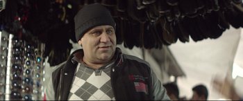 Movie still from “Capernaum” (2018), directed by Nadine Labaki – A person wearing a jacket and a hat; Close Up shot, Low angle