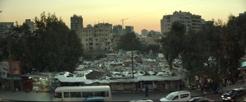 Movie still from “Capernaum” (2018), directed by Nadine Labaki – A view of a lot of garbage in the middle of a city; Extreme Wide shot, High angle