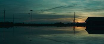 Movie still from “Cave Rescue” (2022), directed by Tom Waller – A body of water that has a lot of water in it; Extreme Wide shot, Low angle