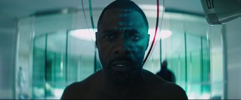 Movie still from “Fast & Furious Presents: Hobbs & Shaw” (2019), directed by David Leitch – A person in a room; Close Up shot, Low angle