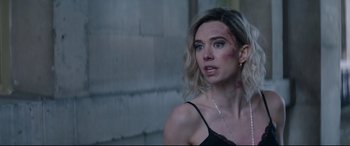 Movie still from “Fast & Furious Presents: Hobbs & Shaw” (2019), directed by David Leitch – A beautiful woman with blonde hair and a black top; Close Up shot, Over the shoulder angle