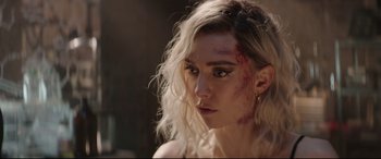 Movie still from “Fast & Furious Presents: Hobbs & Shaw” (2019), directed by David Leitch – A person with a bruise on her face; Close Up shot, Over the shoulder angle