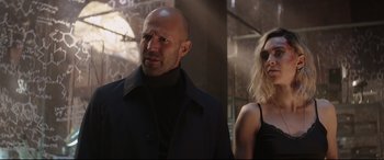 Movie still from “Fast & Furious Presents: Hobbs & Shaw” (2019), directed by David Leitch – A man and a woman standing next to each other; Medium shot, Low angle
