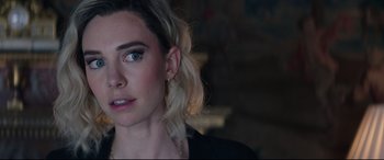 Movie still from “Fast & Furious Presents: Hobbs & Shaw” (2019), directed by David Leitch – A person wearing a black shirt; Close Up shot, Over the shoulder angle