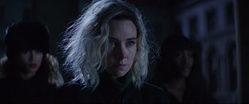 Movie still from “Fast & Furious Presents: Hobbs & Shaw” (2019), directed by David Leitch – A person wearing a black shirt; Close Up shot, Over the shoulder angle