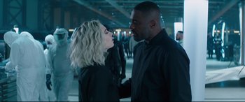 Movie still from “Fast & Furious Presents: Hobbs & Shaw” (2019), directed by David Leitch – A man and a woman standing next to each other; Medium shot, Over the shoulder angle