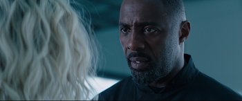 Movie still from “Fast & Furious Presents: Hobbs & Shaw” (2019), directed by David Leitch – A man with a beard is looking at a woman; Close Up shot, Over the shoulder angle