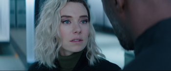 Movie still from “Fast & Furious Presents: Hobbs & Shaw” (2019), directed by David Leitch – A person wearing a jacket; Close Up shot, Over the shoulder angle