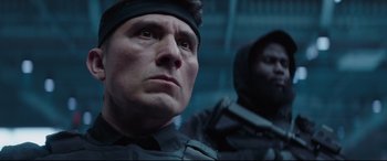 Movie still from “Fast & Furious Presents: Hobbs & Shaw” (2019), directed by David Leitch – A person wearing a helmet; Close Up shot, Low angle