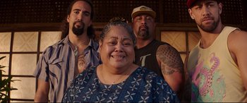 Movie still from “Fast & Furious Presents: Hobbs & Shaw” (2019), directed by David Leitch – A group of people standing next to each other; Medium shot, Over the shoulder angle