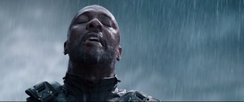Movie still from “Fast & Furious Presents: Hobbs & Shaw” (2019), directed by David Leitch – A man in the rain with his eyes closed; Close Up shot, Low angle