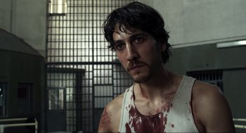 A person with blood all over his face