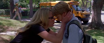 Movie still from “Cellular” (2004), directed by David R. Ellis – A woman and a boy are touching each other's face; Close Up shot, Over the shoulder angle