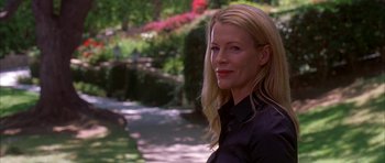 Movie still from “Cellular” (2004), directed by David R. Ellis – A woman in a black shirt is smiling for the camera; Close Up shot, Low angle