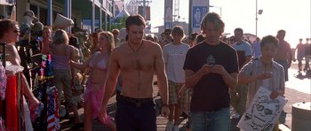Movie still from “Cellular” (2004), directed by David R. Ellis – A group of young people walking down a street; Medium shot, Over the shoulder angle