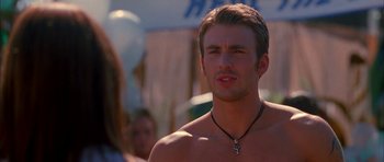 Movie still from “Cellular” (2004), directed by David R. Ellis – A shirtless man with a cross on his neck; Close Up shot, Over the shoulder angle