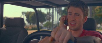 Movie still from “Cellular” (2004), directed by David R. Ellis – A man talking on a cell phone while sitting in a car; Close Up shot, Over the shoulder angle