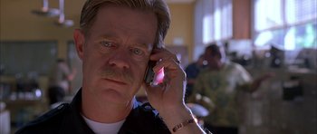 Movie still from “Cellular” (2004), directed by David R. Ellis – A person talking on a cell phone; Close Up shot, Low angle