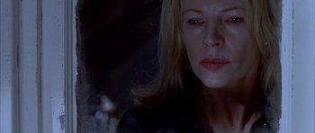 Movie still from “Cellular” (2004), directed by David R. Ellis – A woman's face in the dark; Close Up shot, Low angle