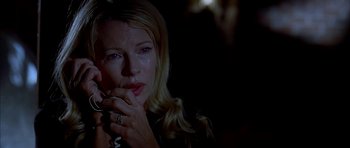 Movie still from “Cellular” (2004), directed by David R. Ellis – A person holding a cell phone to their face; Close Up shot, Low angle