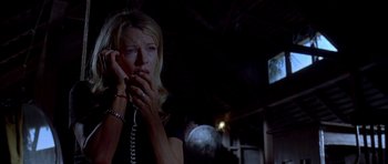 Movie still from “Cellular” (2004), directed by David R. Ellis – A woman holding a phone up to her face; Close Up shot, Low angle